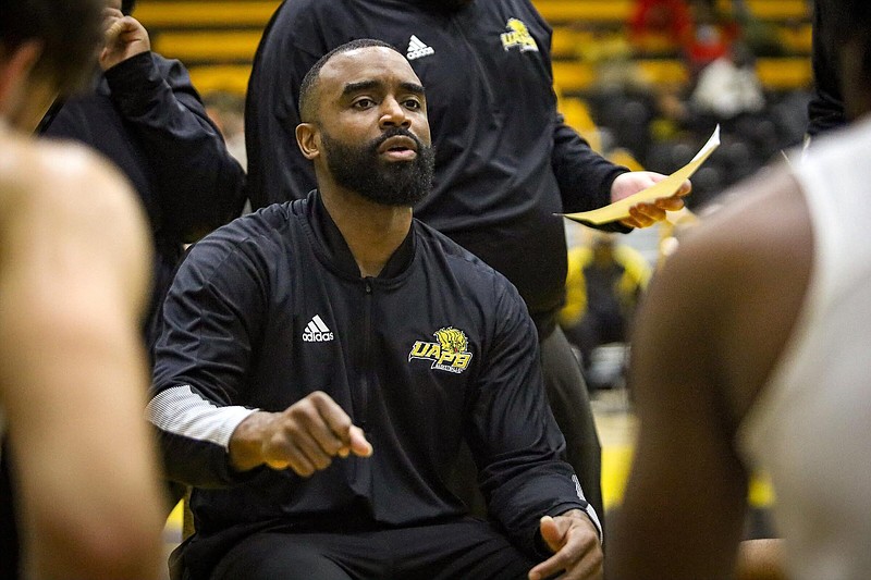UAPB head coach Solomon Bozeman directs his troops during a timeout during the 2021-22 season. (Special to The Commercial)