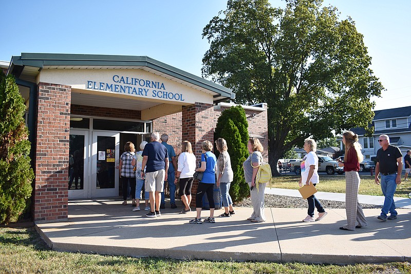 Democrat photo/Garrett Fuller — Grandparents are seen Friday entering California Elementary School to join their grandchildren for activities.