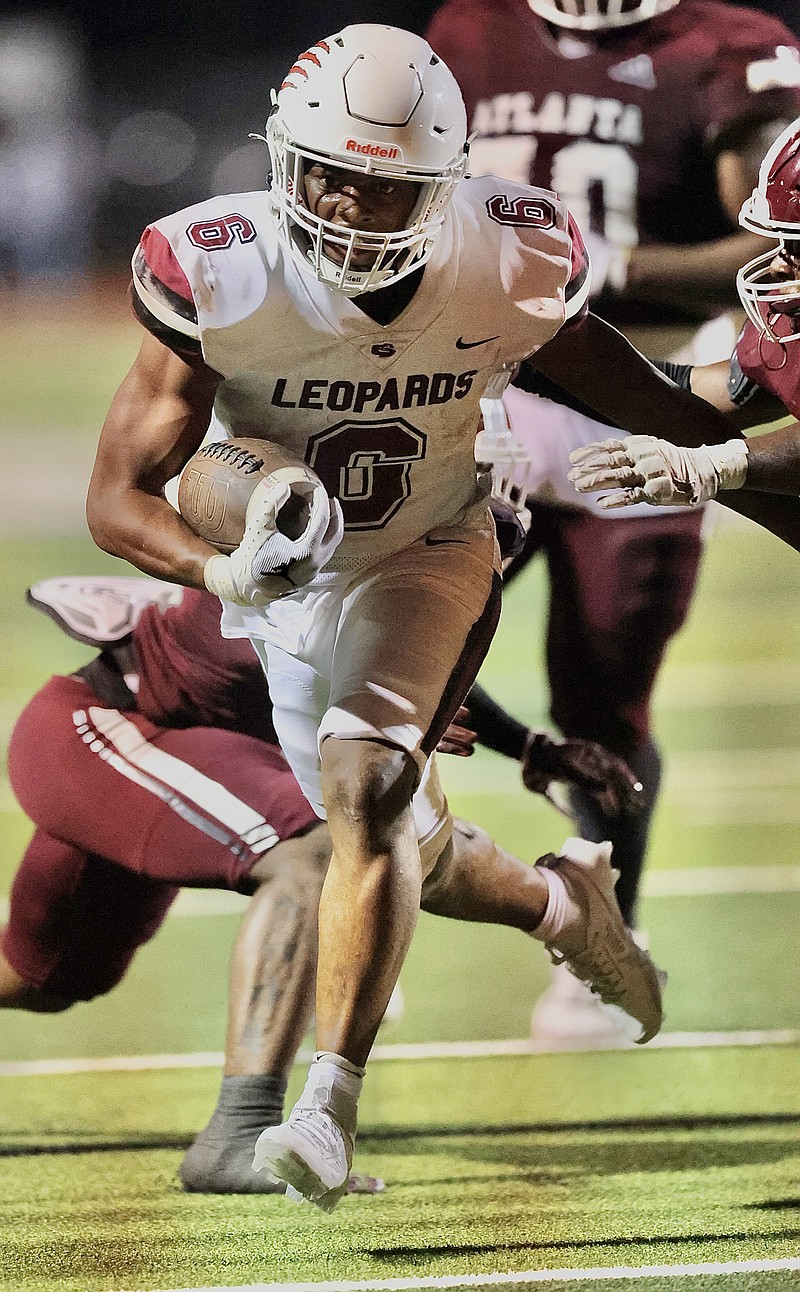 Liberty-Eylau running back Greg London runs through Atlanta defenders on Friday, Sept. 15, 2023, in Atlanta, Texas. (Photo by JD for the Texarkana Gazette)