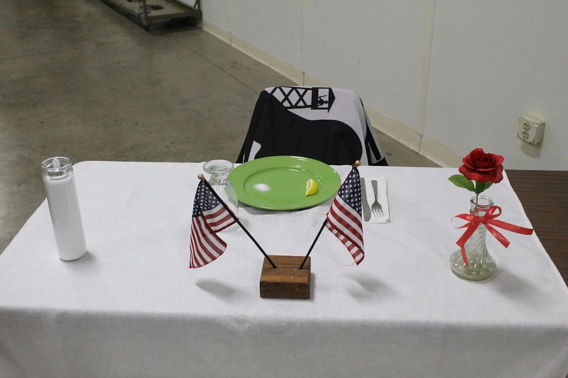Staff reporter 
Displayed on a table are various emblems that symbolize the dignity and honor of veterans who are missing-in-action or prisoners of war.
