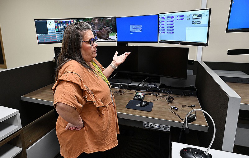 Carla Holcroft, director of communications for Washington County's Sheriffs Office, shows dispatcher work stations Wednesday in a call center being constructed in the county detention center in Fayetteville. The county is nearing activation of the new emergency communications system, which includes combining the dispatch centers for Central Emergency Medical Services and the Sheriffs Office. The system will link emergency services throughout the county to each other and with the statewide AWIN system. Visit nwaonline.com/photo for today's photo gallery.
(NWA Democrat-Gazette/Andy Shupe)