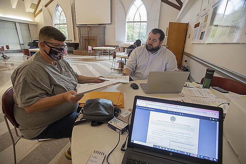 Jennifer Rose of Fayetteville (left) consults with attorney Josh Eide about getting two felony charges from 1998 sealed during a clinic July 8. The Arkansas Justice Reform Coalition & Legal Aid of Arkansas will host a second record sealing clinic at St Pauls church today in Fayetteville. Visit nwaonline.com/photo for todays photo gallery.

(File Photo/NWA Democrat-Gazette/J.T. Wampler)