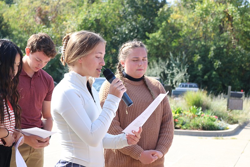 Anna Campbell/News Tribune photo: 
Calvary Lutheran High School student Mikayla Yutzy leads a prayer asking for God's guidance in government at Calvary's See You at the Pole prayer gathering around the school flagpole in Jefferson City.