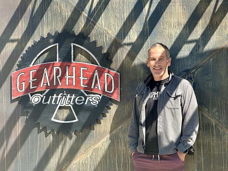 Ted Herget stands outside his Gearhead Outfitters store in Jonesboro.