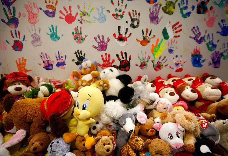 NWA Media/JASON IVESTER --11-27-2013--
Clients are given a stuffed toy and leave a painted handprint on the walls of the Children's Safety Center in Springdale. There are over 6500 handprints on the walls of the non-profit organization which started in 1997.