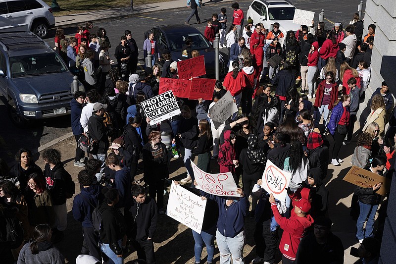 Students from East High School and West High School enter the State Capitol to call for gun control measures to be considered by state lawmakers Thursday, March 23, 2023, during a rally in Denver. A shooting left two administrators injured at East High School on Wednesday, one of a series of gun-related events at the school in the past six weeks. (AP Photo/David Zalubowski)
