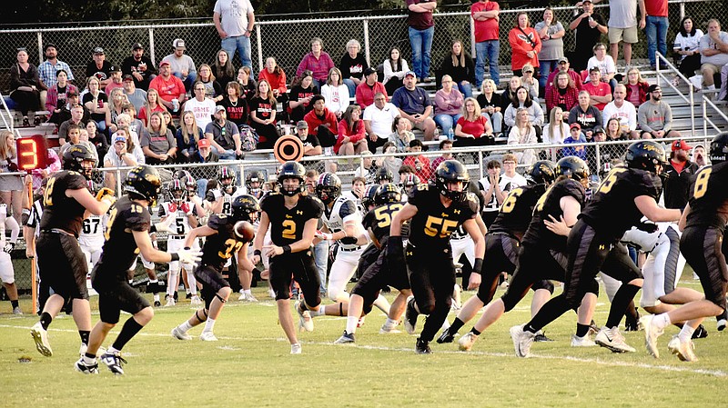 Mark Humphrey/Enterprise-Leader/Prairie Grove senior quarterback Luke Vance pitches the football to junior halfback Jace Edwards during the Tigers' 41-14 loss to the Blackhawks in the 5A West Conference opener for both teams on Friday, Sept. 22, 2023, at Prairie Grove's Tiger Den Stadium.