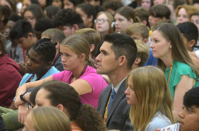 Hellstern Middle School teacher Michael Tapee listens to remarks on Tuesday Oct. 3 2023 before the announcement that he is a Milken Educator Award recipient. Tapee teaches math and robotics at the Springdale school. Go to nwaonline.com/photos for today's photo gallery.
(NWA Democrat-Gazette/Flip Putthoff)