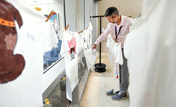 Shirts memorialize domestic abuse victims during remembrance at Veterans Health Care System of the Ozarks facility in Fayetteville