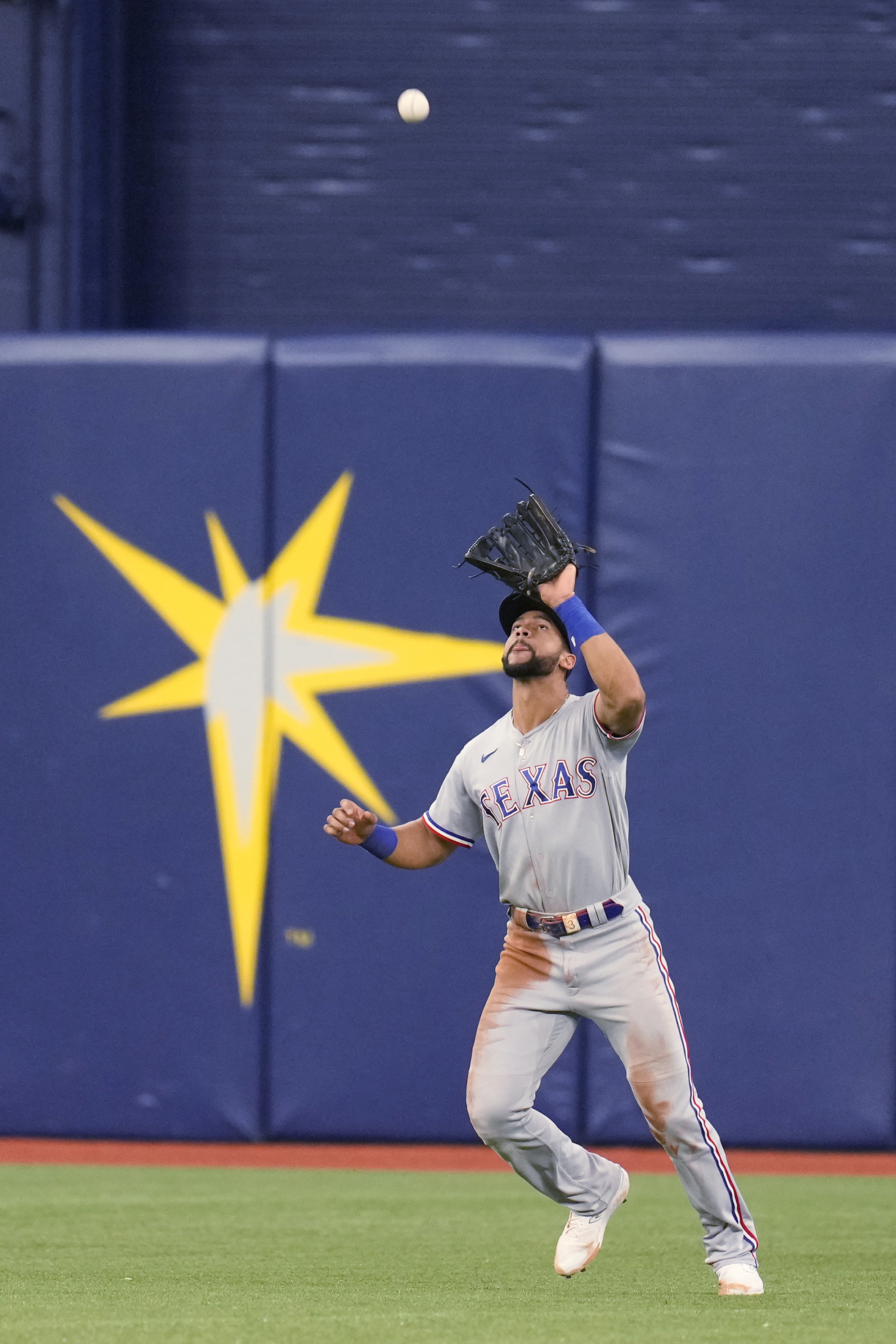 Leody Taveras of the Texas Rangers follows through on a fourth inning in  2023