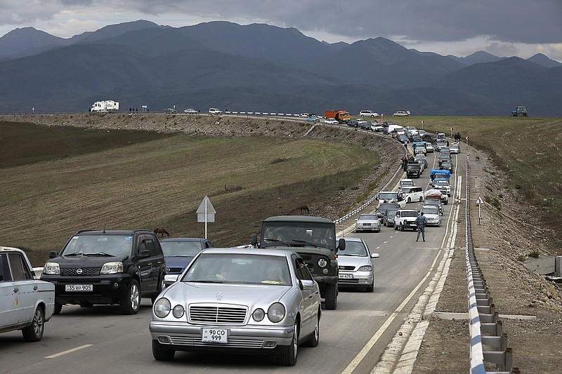 FILE - A convoy of cars of ethnic Armenians from Nagorno-Karabakh move to Kornidzor in Syunik region, Armenia, on Sept. 26, 2023. Israel has quietly helped fuel Azerbaijans campaign to recapture Nagorno-Karabakh, officials and experts say, supplying powerful weapons to Azerbaijan ahead of its lightening offensive last month that brought the Armenian enclave in its territory back under its control. (AP Photo/Vasily Krestyaninov, File)