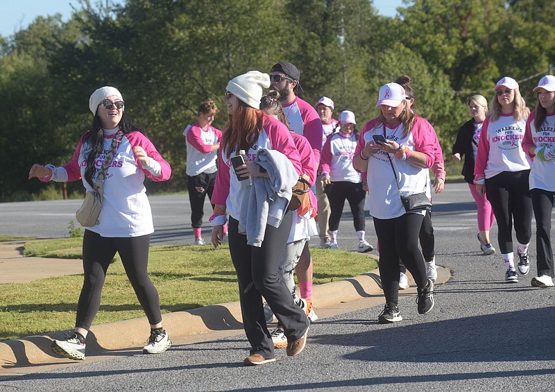 Walker round a bend on Saturday Oct. 7 2023 during the More Than Pink walk in Rogers. Go to nwaonline.com/photos for today's photo gallery.
(NWA Democrat-Gazette/Flip Putthoff)