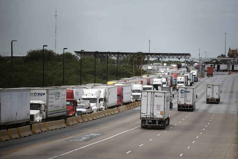 Trucks travel across the World Trade International Bridge in Laredo, Texas. Callaghan O'Hare