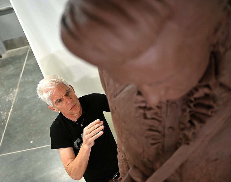 Kevin Kresse works on the clay model for his Johnny Cash statue in July 2022.

(Democrat-Gazette file photo/Stephen Swofford)