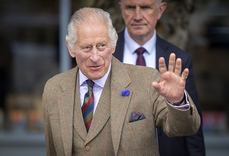 FILE - Britain's King Charles III waves during his visit to the Discovery Centre and Auld School Close to hear more about the 3.3million pound (4.1 million US dollars) energy efficient housing project in the area, in Tomintoul, Scotland, Wednesday, Sept. 13, 2023. Buckingham Palace announced Wednesday, Oct. 11, 2023, that King Charles III will travel to Kenya later this month for a state visit full of symbolism: His mother, the late Queen Elizabeth II, learned she had become queen while visiting a game preserve in the East African nation in 1952. (Jane Barlow/Pool Photo via AP, File)