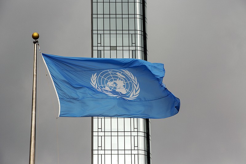 FILE - The UN flag flies on a stormy day at the United Nations during the United Nations General Assembly on Thursday, Sept. 22, 2022. A U.N. official says the eight peacekeepers have been suspended and detained in eastern Congo on allegations of sexual exploitation. The United Nations said on Wednesday, Oct. 11, 2023 that it has taken “strong measures in response to reports of serious misconduct by peacekeepers.” The peacekeepers have been confined pending further details and a full investigation.  (AP Photo/Ted Shaffrey, File)