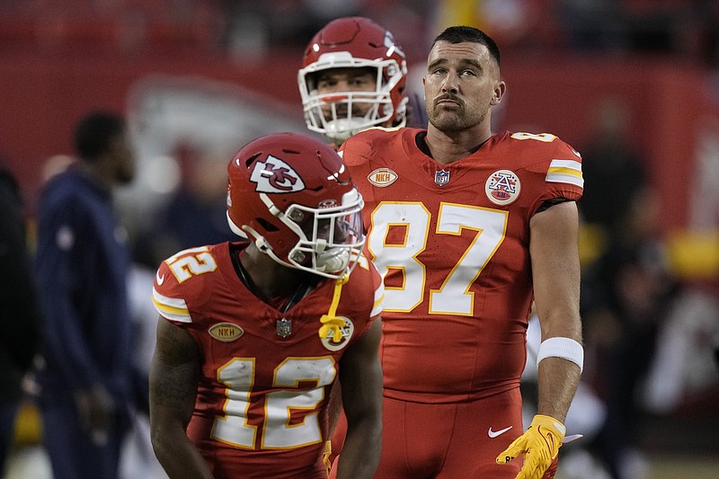Kansas City Chiefs' Travis Kelce (87) and teammates warm up for an NFL football game against the Denver Broncos, Thursday, Oct. 12, 2023, in Kansas City, Mo. (AP Photo/Charlie Riedel)