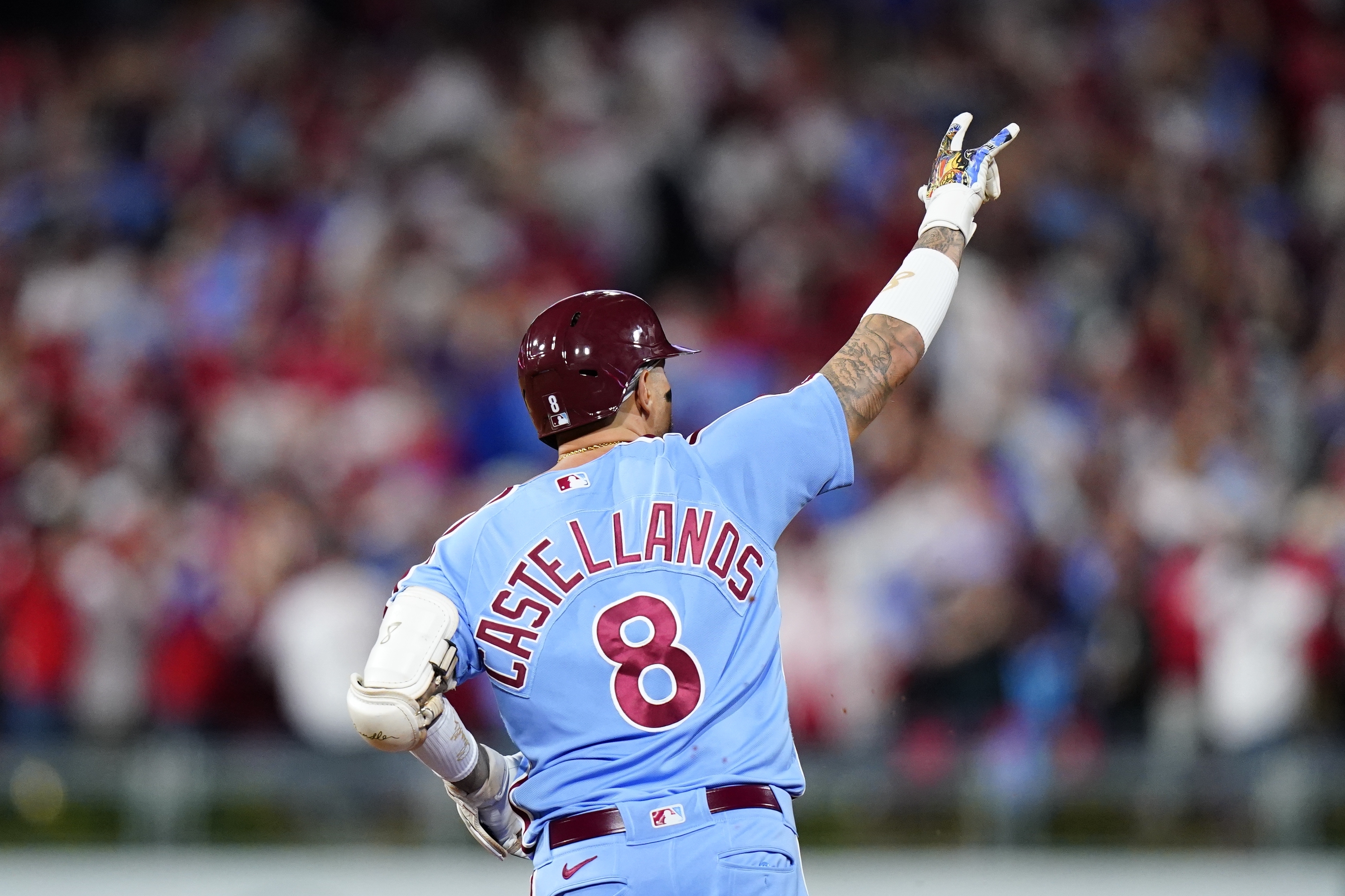 Philadelphia Phillies' Nick Castellanos, right, reacts to his hit