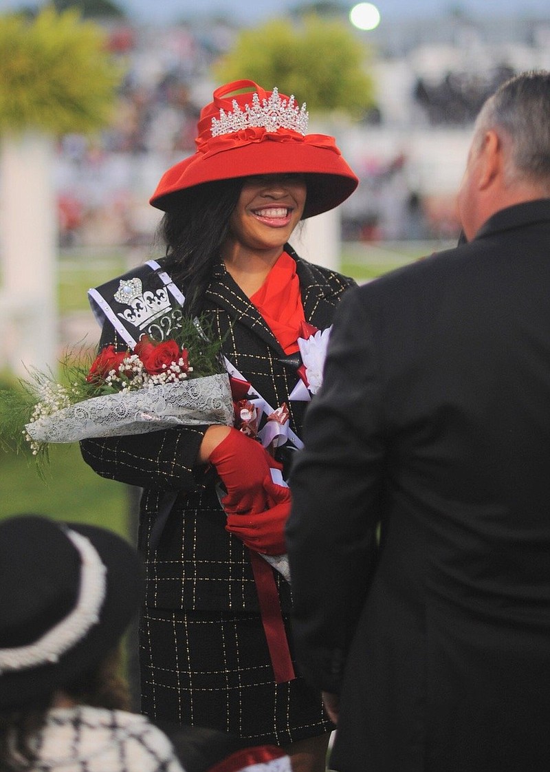 Laila Adams wears the crown presented to her by Scott Ray, vice president of the White Hall School Board, on Friday before the Homecoming game against Pine Bluff. (Special to The Commercial/William Harvey)