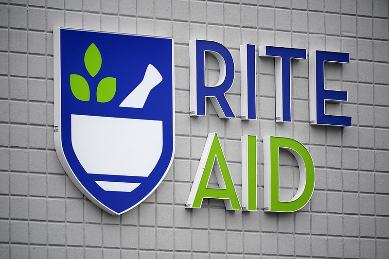 FILE - This photo shows a sign of Rite Aid on its store in Pittsburgh on Jan. 23, 2023. Rite Aid, a major U.S. pharmacy chain, said Sunday, Oct. 15, that it has filed for bankruptcy as part of its effort to restructure its finances. (AP Photo/Gene J. Puskar, File)