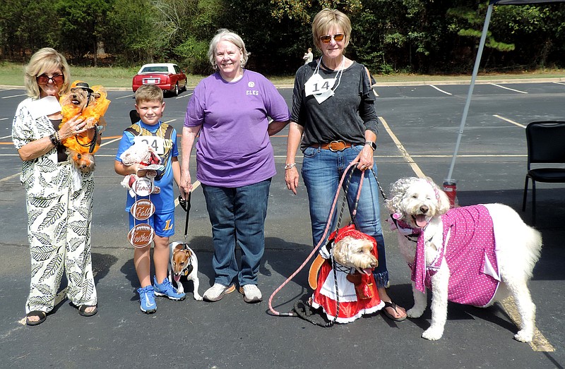 From left are Sherry Belanger with Bella, third place, Best Costume; Beau Dickerson with Peanut, second place, Best Costume; and Sue Wilson with Maddie and Gerald, first place as a team, Best Costume. - Submitted photo