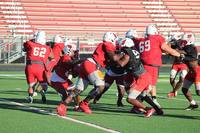 Photo By: Michael Hanich
The defensive line shuts down any running lanes for the offense in practice on Tuesday, Oct. 17.
