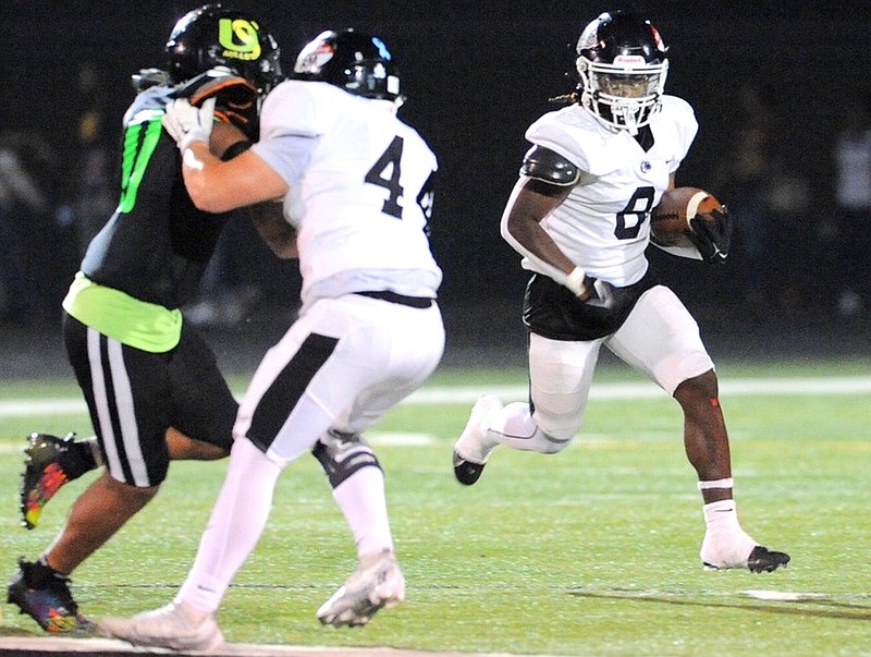Jamarion Black of White Hall carries the ball against Mills University Studies in a Sept. 22 game in Little Rock. (Special to The Commercial/William Harvey)