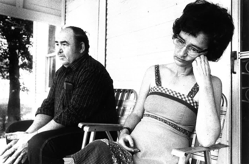 Weldon Alexander, left, and Vera Alexander sit on their porch May 10, 1981, about a month after the murder of their children on Baden Street in Texarkana, Arkansas. (Texarkana Gazette file photo)