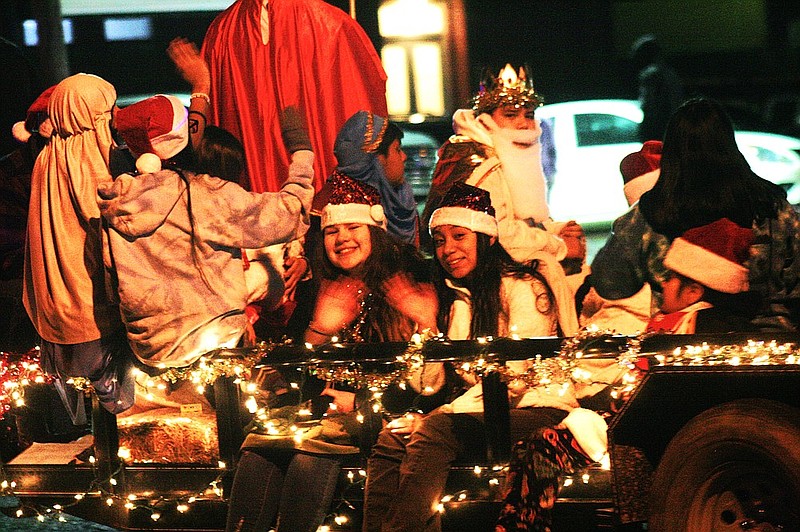 El Dorado Christmas parade participants wave from their float in this 2022 News-Times file photo. The Chamber of Commerce is currently accepting entries for the 2023 parade.