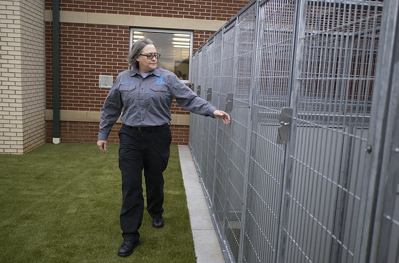 Then-Animal Services Supervisor Mandy Tedford walks past kennels Feb. 16 in the play yard at the Bentonville Animal Services and Adoption Center in Bentonville.

(File Photo/NWA Democrat-Gazette/Charlie Kaijo)