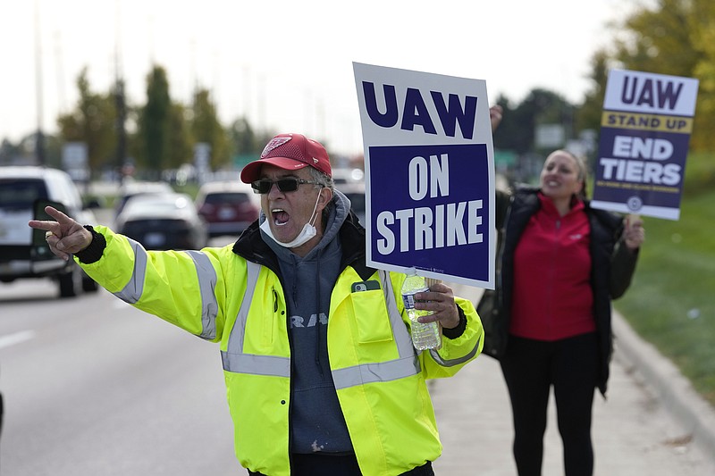 George Raad, a United Auto Worker member, walks the picket line during a strike at the Stellantis Sterling Heights Assembly Plant, in Sterling Heights, Mich., Monday, Oct. 23, 2023. (AP Photo/Paul Sancya)