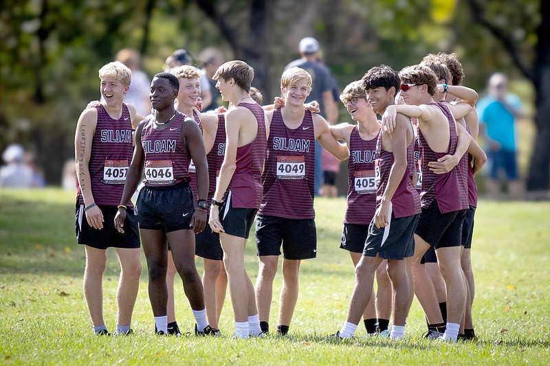 Krystal Elmore/Special to Herald-Leader
Members of the Siloam Springs boys cross country team huddle up prior to the 5A-West Conference meet Thursday on the grounds of Simmons Foods in Siloam Springs.