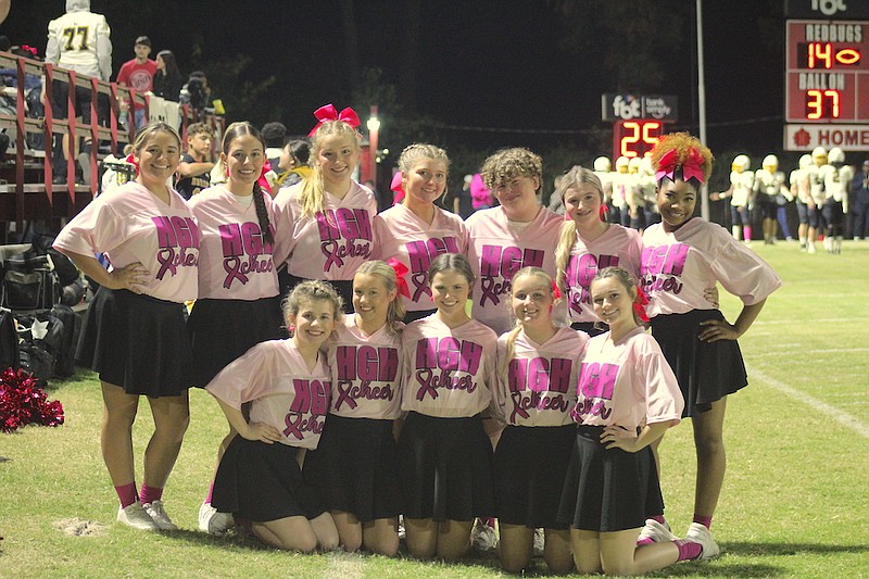 Photo By: Michael Hanich
The Harmony Grove cheerleading squad pose for a picture in their pink uniforms in the game between Harmony Grove and Fordyce.