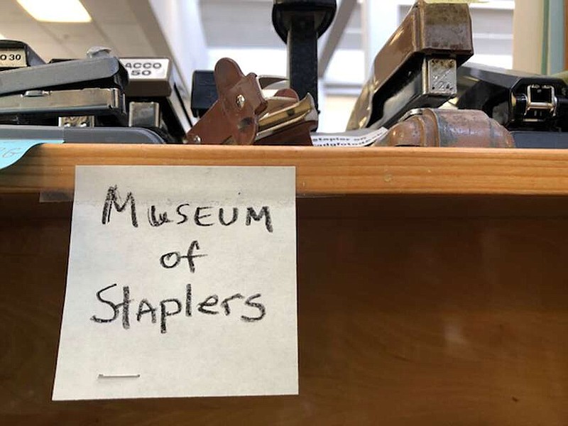 The Museum of Staplers in the Arkansas Democrat-Gazette newsroom honors the memory of staff members who no longer have their staplers. (Arkansas Democrat-Gazette/Celia Storey)