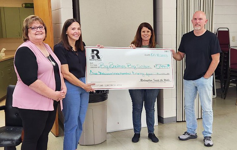 Courtesy/Redemption Inside the Walls: 
Redemption Inside the Walls organizers Paula Benne and Kirk DeMars, along with silent auction coordinator Darlene Norment, present a check in Jefferson City to Big Brothers Big Sisters Director Jessica Kever.