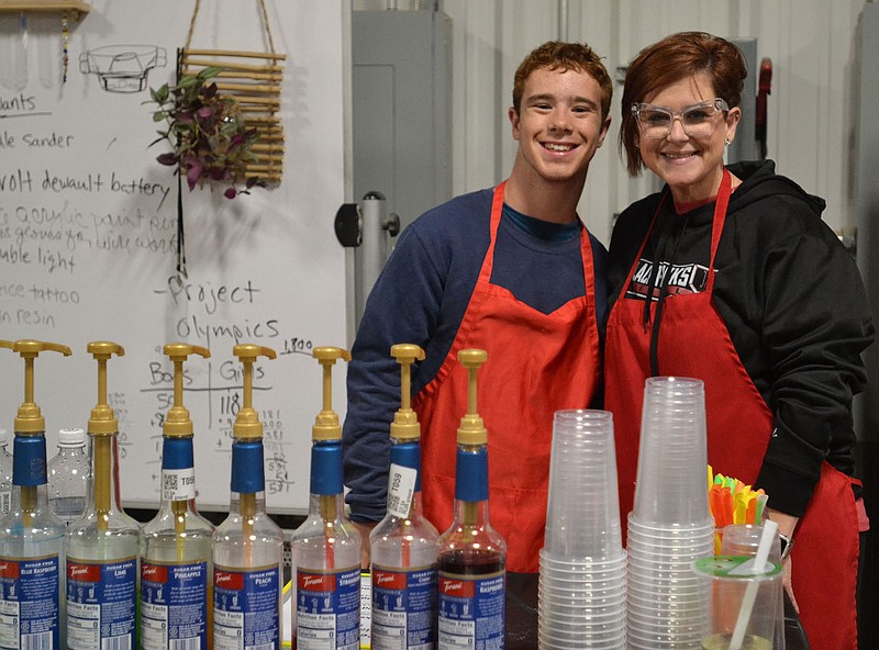 Annette Beard/Pea Ridge TIMES
Student Angus Trotter (left) and teacher Jen Jacobs sold drinks at the annual Project 479 student market Friday, Oct. 27.