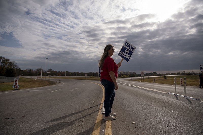 Sherry Barger pickets with other workers near the General Motors plant in Spring Hill, Tenn., after United Auto Workers Local 1853 announced a strike after 44 days of negotiations with GM, Sunday, Oct. 29, 2023. (Nicole Hester/The Tennessean via AP)