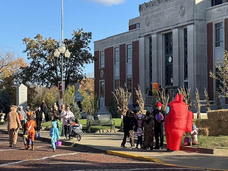 Anakin Bush/Fulton Sun
Trick-or-Treaters leave the Old Callaway County Courthouse to start the Trick-or-Treat on the Bricks route Tuesday. This year's event was expanded to include the Courthouse in the route.
