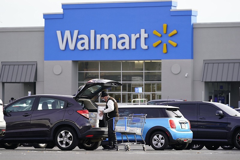 Walmart-Doula
FILE - A customer loads a car after shopping at a Walmart in Philadelphia, Nov. 17, 2021. Walmart, the nation's largest private employer, is expanding nationwide its health care coverage next month for employees who want to enlist the services of a doula, a person trained to assist women during pregnancies. (AP Photo/Matt Rourke, file)