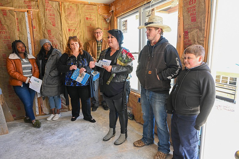 Dozens of volunteers gather to pray for a new Habitat home Jefferson