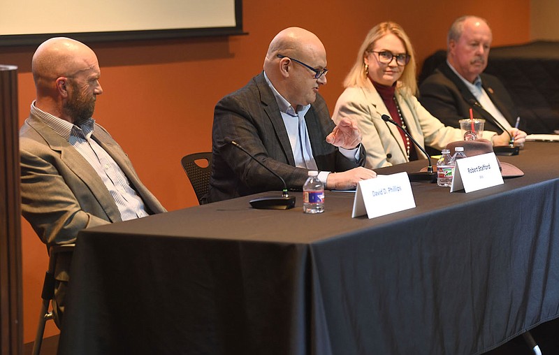 Candidates David Phillips (from left), Bob Stafford, Katy Sager and S Robert Smith answer questions Wednesday during a public forum at the Fayetteville Public Library for the four candidates seeking the Ward 1 City Council seat in a special election. Visit nwaonline.com/photo for todays photo gallery.

(NWA Democrat-Gazette/Andy Shupe)