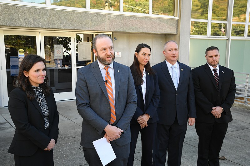 U.S. Attorney David Clay Fowlkes of the Western District of Arkansas, second from left, with Assistant U.S. Attorney Carly Marshall, left, speaks following the sentencing of Dayla Ferrer in front of the Federal Building Thursday morning. (The Sentinel-Record/Lance Brownfield)