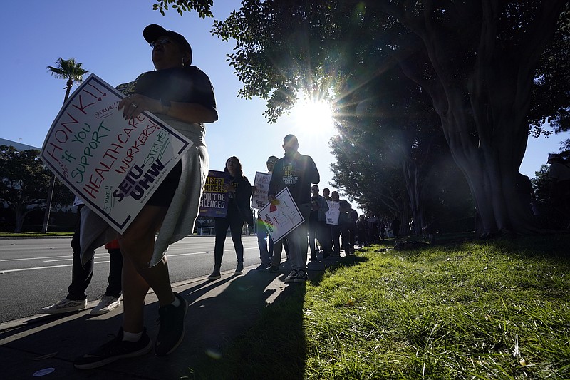 File - Kaiser Permanente workers picket during a three-day health care strike on Oct. 4, 2023, in Irvine, Calif. From auto production lines to Hollywood, the power of labor unions is back in the national spotlight. (AP Photo/Ryan Sun, File)