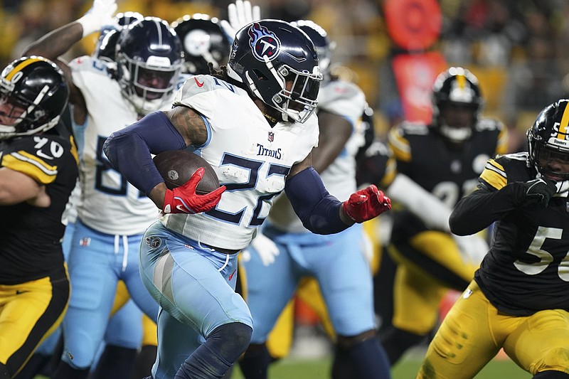 Tennessee Titans running back Derrick Henry (22) runs the ball against the Pittsburgh Steelers during the first half of an NFL football game Thursday, Nov. 2, 2023, in Pittsburgh. (AP Photo/Matt Freed)