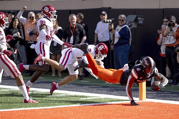 Gordon scores pair of TDs vs Sooners