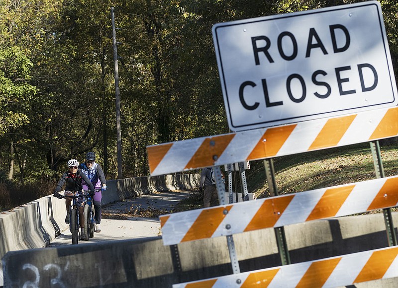 A road closed sign is displayed Thursday along Northeast A Street in Bentonville. Work on a flyover bridge that will be part of the Razorback Greenway near the Crystal Bridges Museum of American Art is on schedule. Visit nwaonline.com/photos for todays photo gallery.

(NWA Democrat-Gazette/Charlie Kaijo)