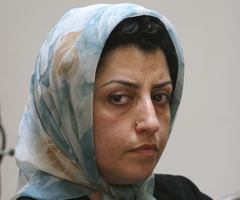FILE - Prominent Iranian human rights activist Narges Mohammadi attends a meeting on women's rights in Tehran, Iran, Aug. 27, 2007.  A campaign urging Iran to free Nobel Peace Prize laureate Narges Mohammadi said Monday, Nov. 6, 2023, that the activist had started a hunger strike over the conditions of her imprisonment and the country's mandatory headscarf for women. (AP Photo/Vahid Salemi, File)