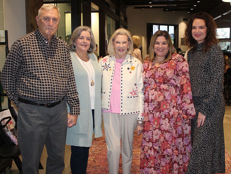 Dennis and Glenda DeBusk (from left); Johnelle Hunt; Elizabeth Schackelford, Children's Safety Center ofWashington County  executive director; and Emily Rappe-Fisher stand for a photo at the Locale fashion show to benefit the center Oct. 27 at First National Bank in Fayetteville. The nonprofit organization opened the doors of its new home, the J.B. and Johnelle Hunt Family Children's Safety Center, Nov. 6 in Springdale. (NWA Democrat-Gazette/Carin Schoppmeyer)