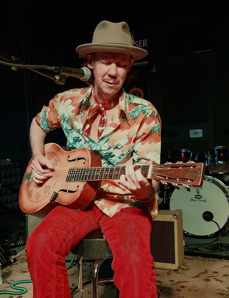 While the rest of the band took a short break, Chad Marshall picked up a 1930 vintage National resonator and treated the crowd to old-school blues during the Nov. 4 Blues By Budweiser concert series at RJ's Grill & Bar. (Special to The Commercial/Jean Jester)
