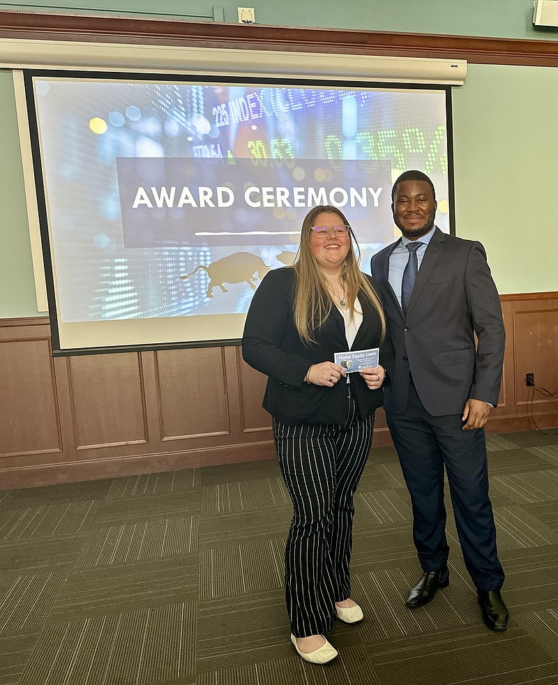 Photo courtesy Westminster College
Fulton High School student Natalie Bruno poses for a photo with Jonathan Banza at the Stock Pitch Competition on Friday. Bruno won first place in the contest and received $100 in prize money.